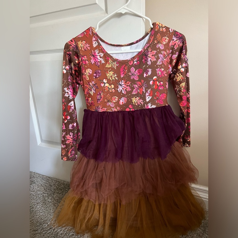 Fall dress bought from Etsy. 6/8 but more like a 9/10. Runs big.
